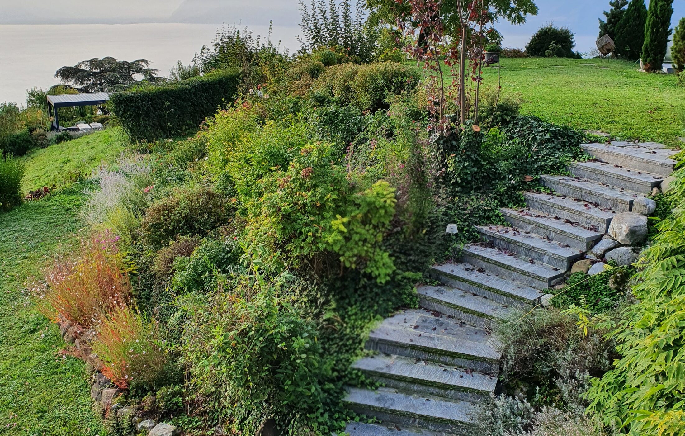 Garden with stone steps and a Lake Geneva view